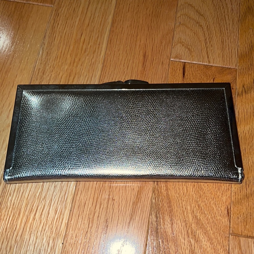 Silver clutch with pockets inside